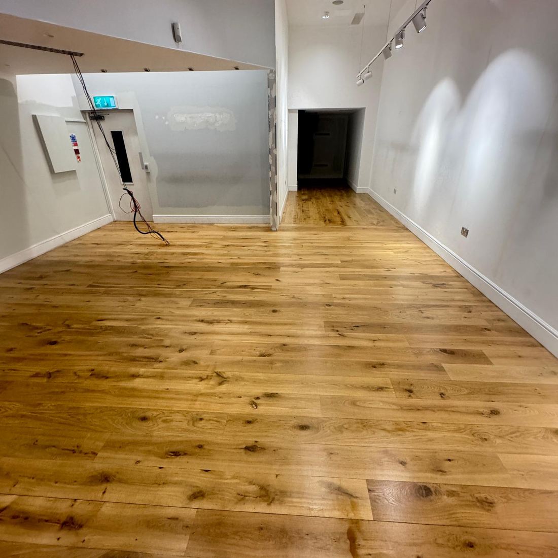 Finished floorboards in a bright room
