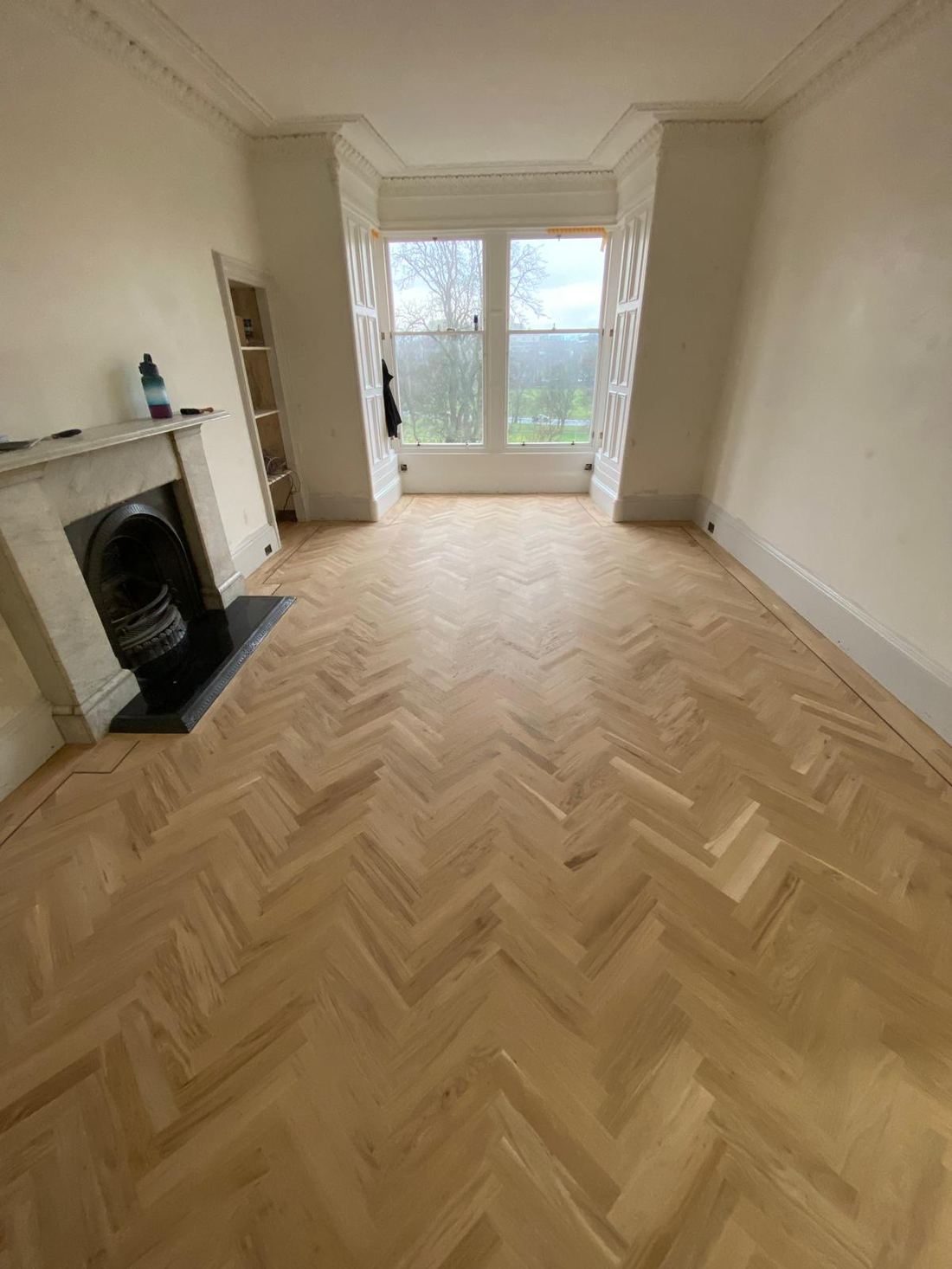 Restored herringbone parquet in a living room