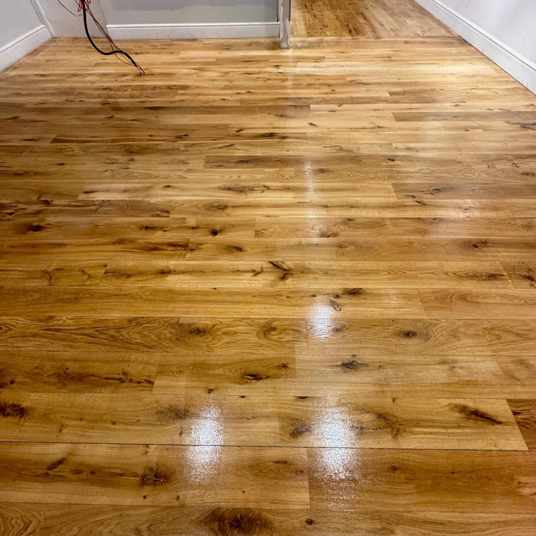Rich varnished pine floorboards