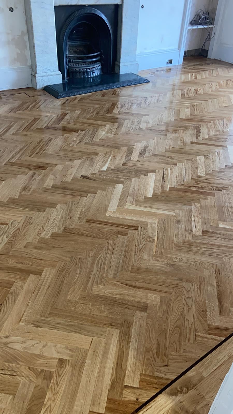 Glossy finished herringbone floor